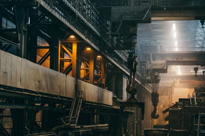 Heavy industrial plant interior with overhead crane